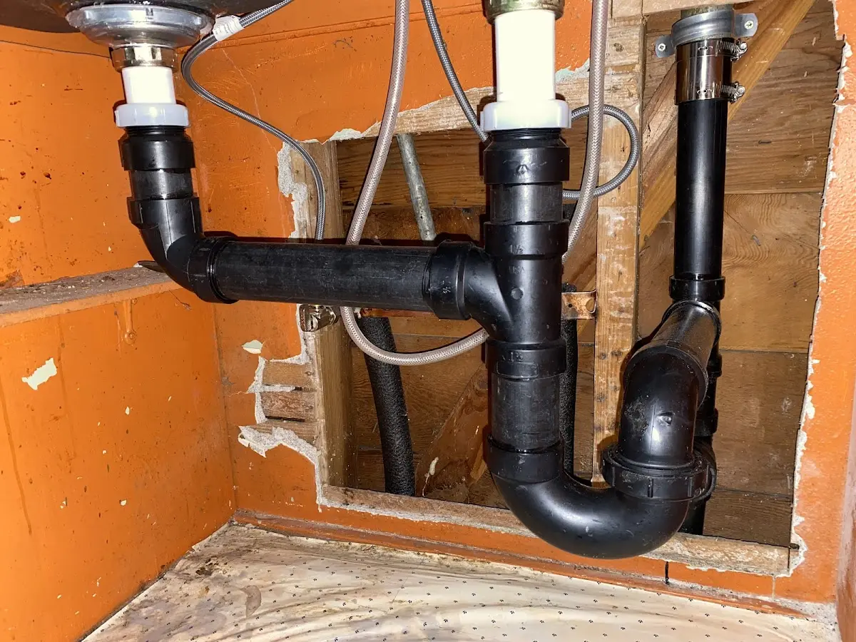 Professional Garbage Disposal Repair equipment and tools on the job in Edgemere